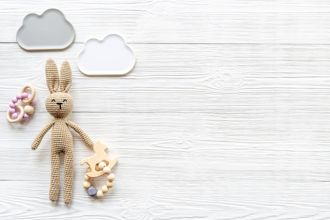 Plush toy rabbit for newborn baby - background for baby shower